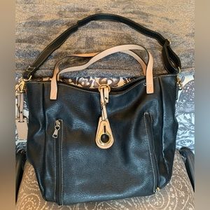 Beautiful black/tan leather concealed carry bag.